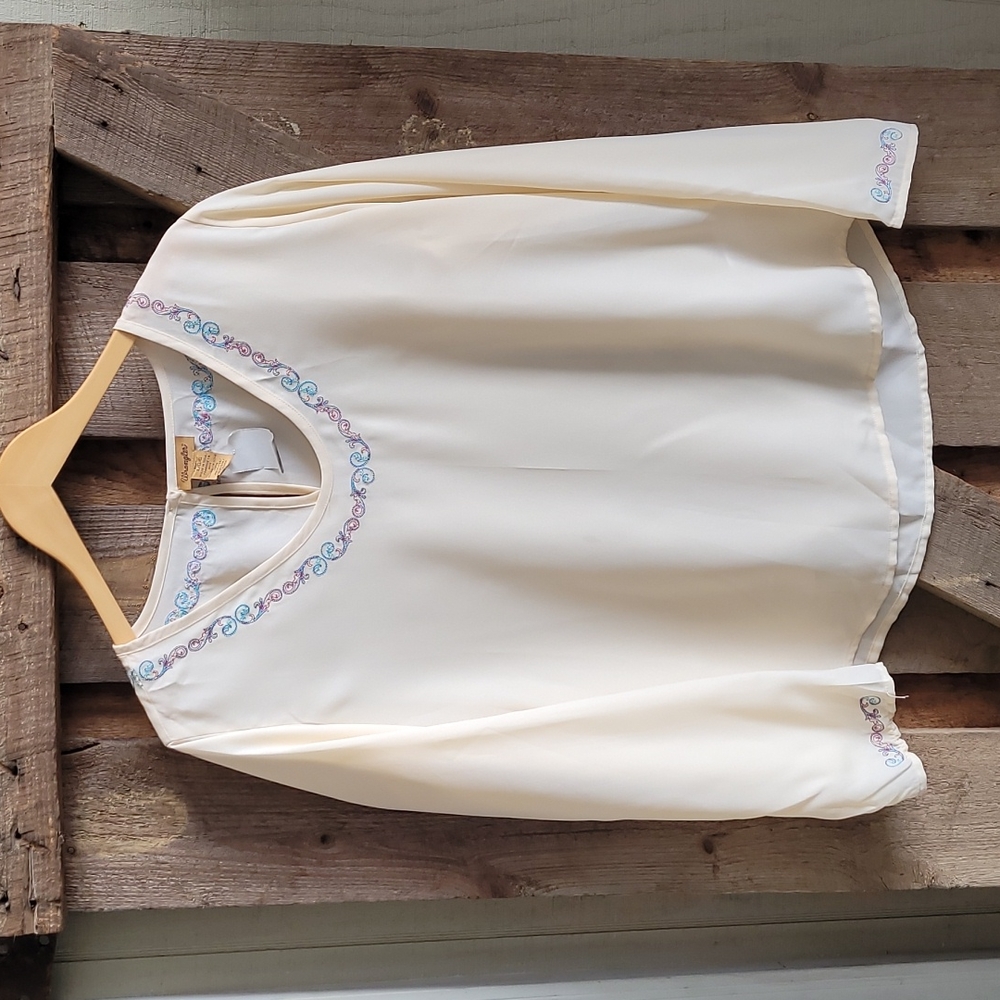 Brand new ladies u neck with embroidery detail on neck and sleeve.